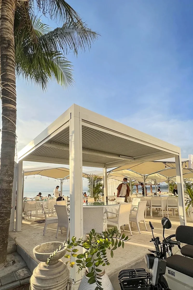 White pergola for beach club seating area